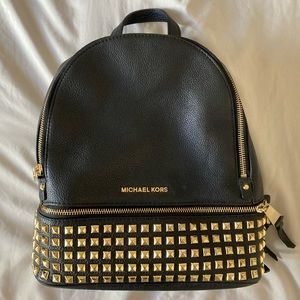 small black leather and gold studded michael kors backpack